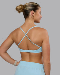 Woman wearing Ascend Sports Bra - Crystal Blue | Thumbnail Index: 1