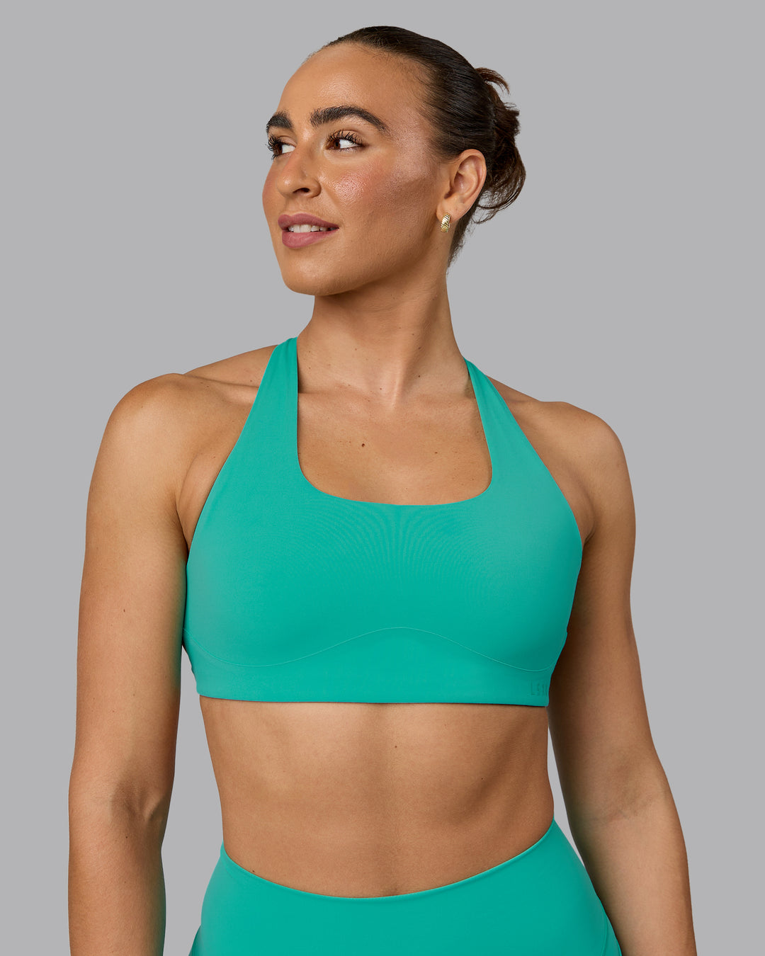 Woman wearing Aspire Sports Bra - Atlantis - view 3