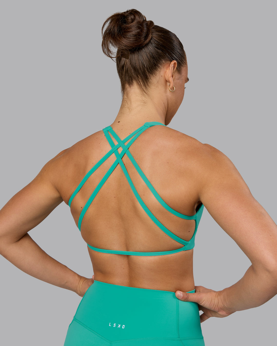 Woman wearing Aspire Sports Bra - Atlantis - view 8