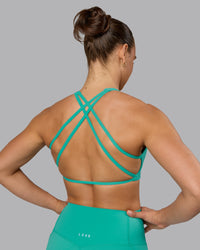Woman wearing Aspire Sports Bra - Atlantis | Thumbnail Index: 7
