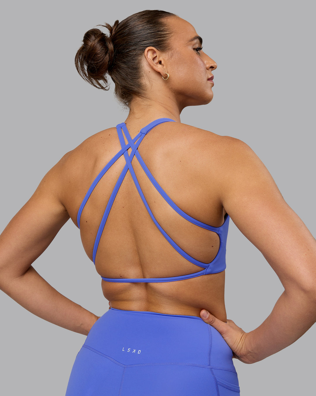 Woman wearing Aspire Sports Bra - Baja Blue - view 7