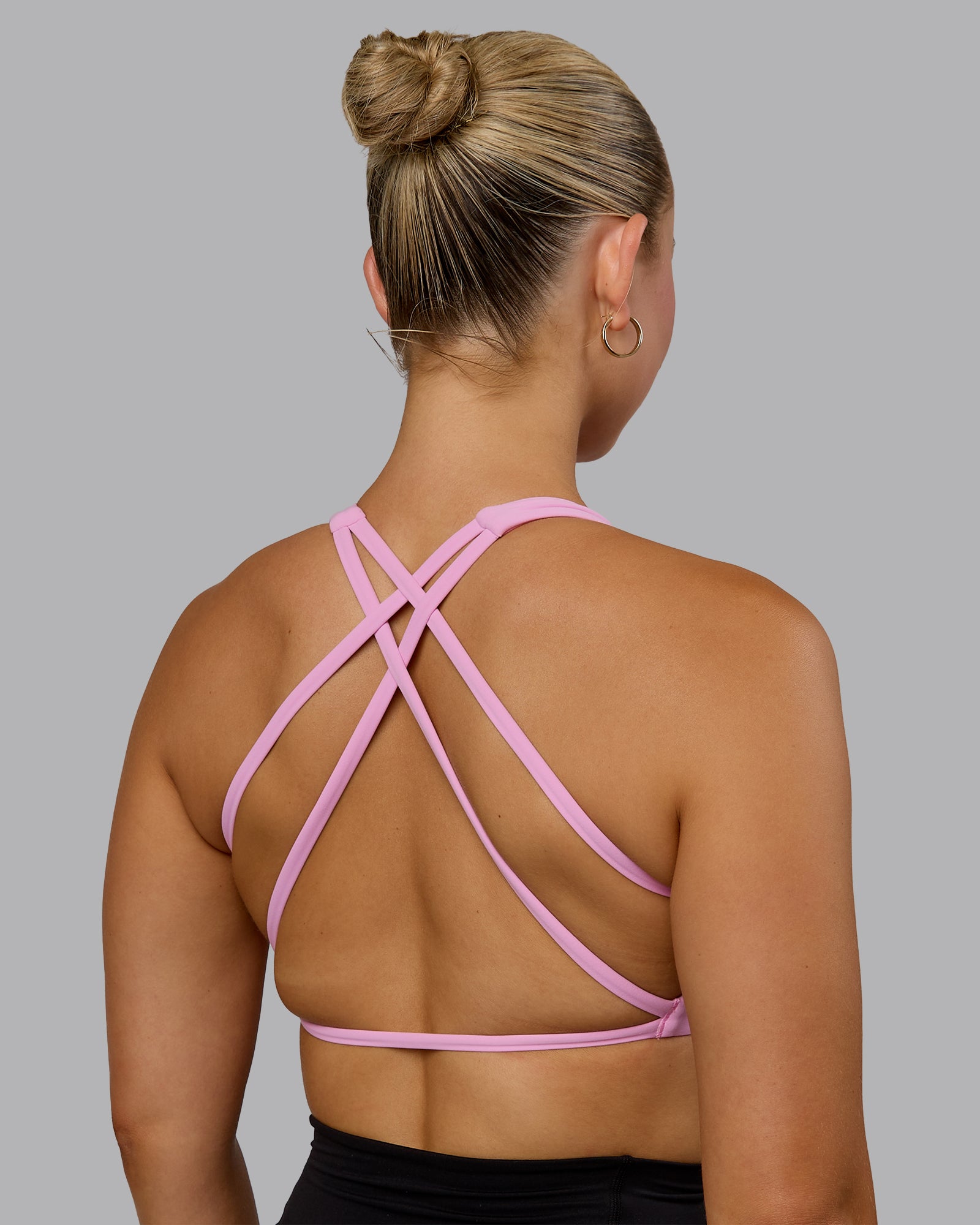 Woman wearing Aspire Sports Bra - Bubblegum