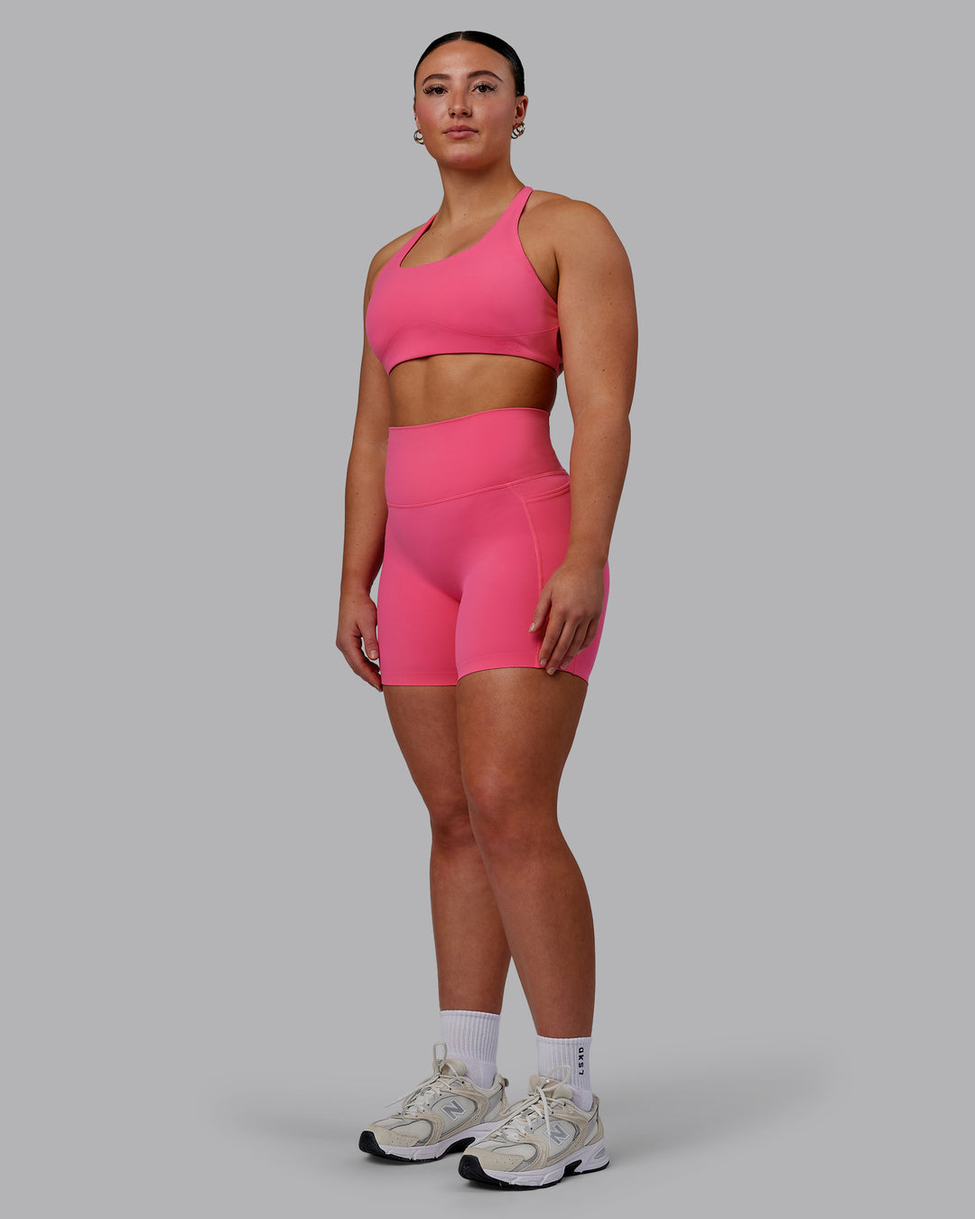 Woman wearing Aspire Sports Bra - Carmine Rose - view 4