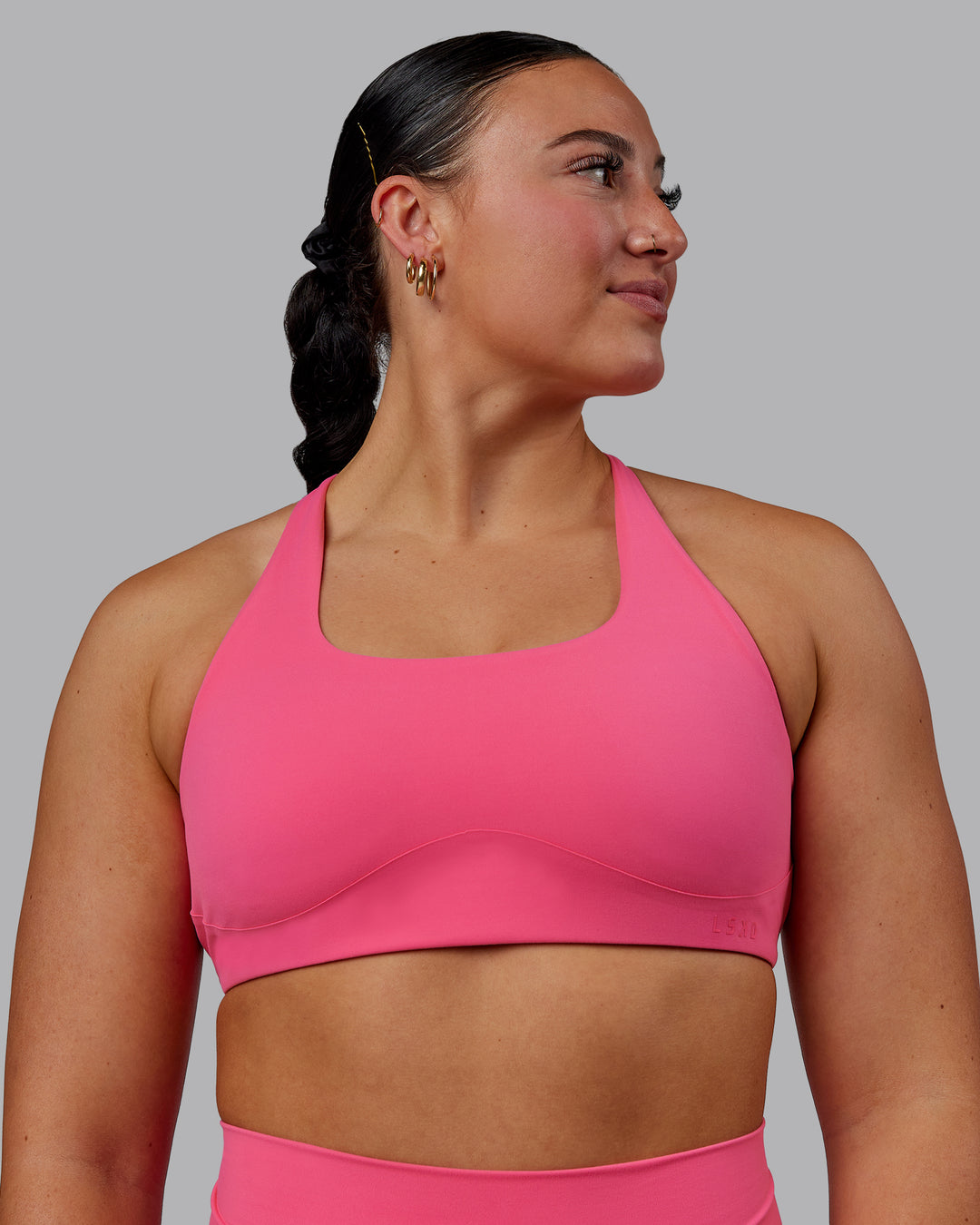 Woman wearing Aspire Sports Bra - Carmine Rose - view 1