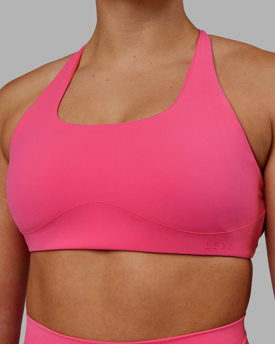 Woman wearing Aspire Sports Bra - Carmine Rose - view 5