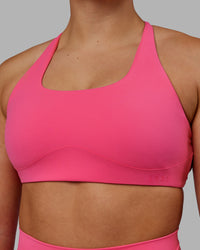 Woman wearing Aspire Sports Bra - Carmine Rose | Thumbnail Index: 4