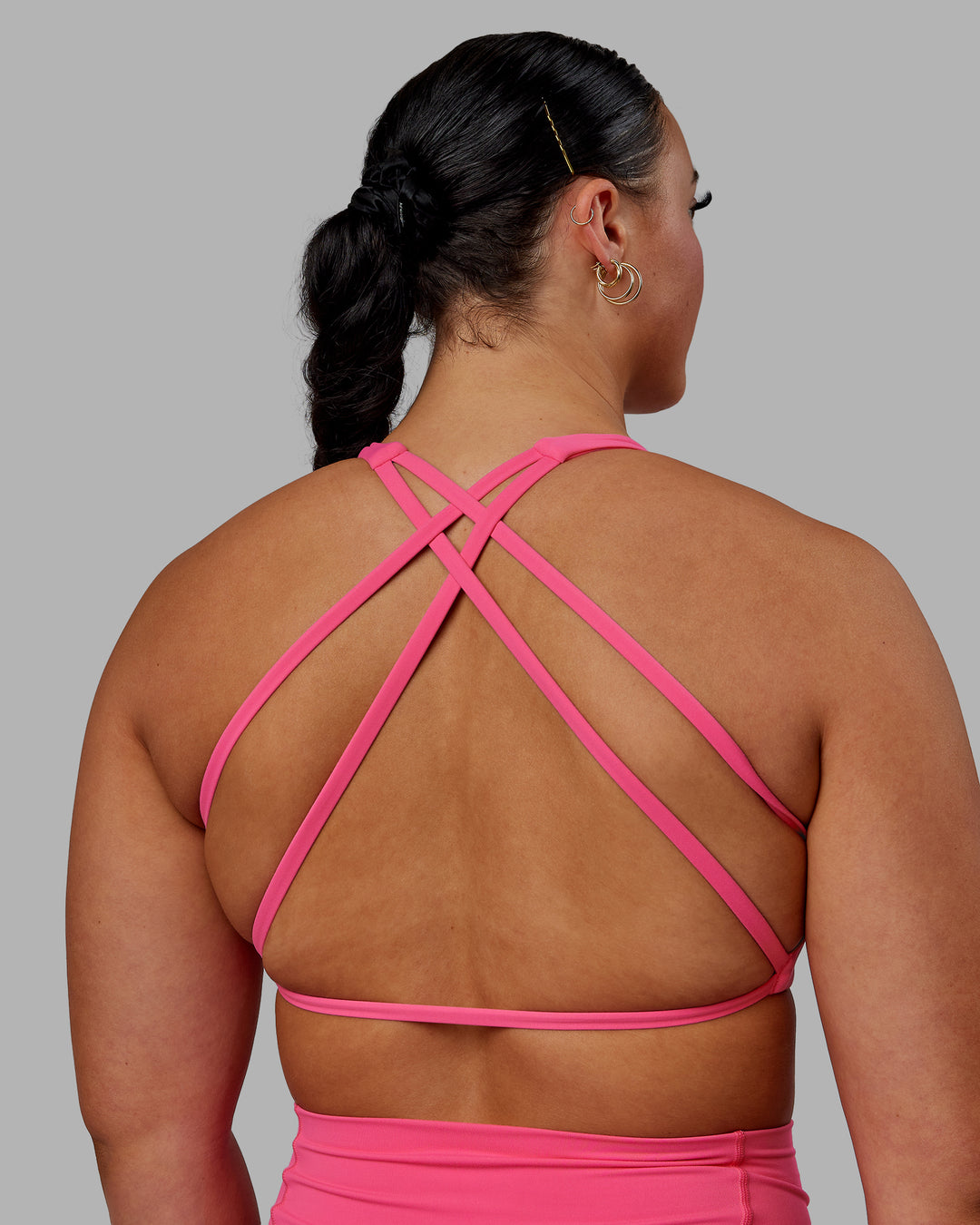 Woman wearing Aspire Sports Bra - Carmine Rose - view 8