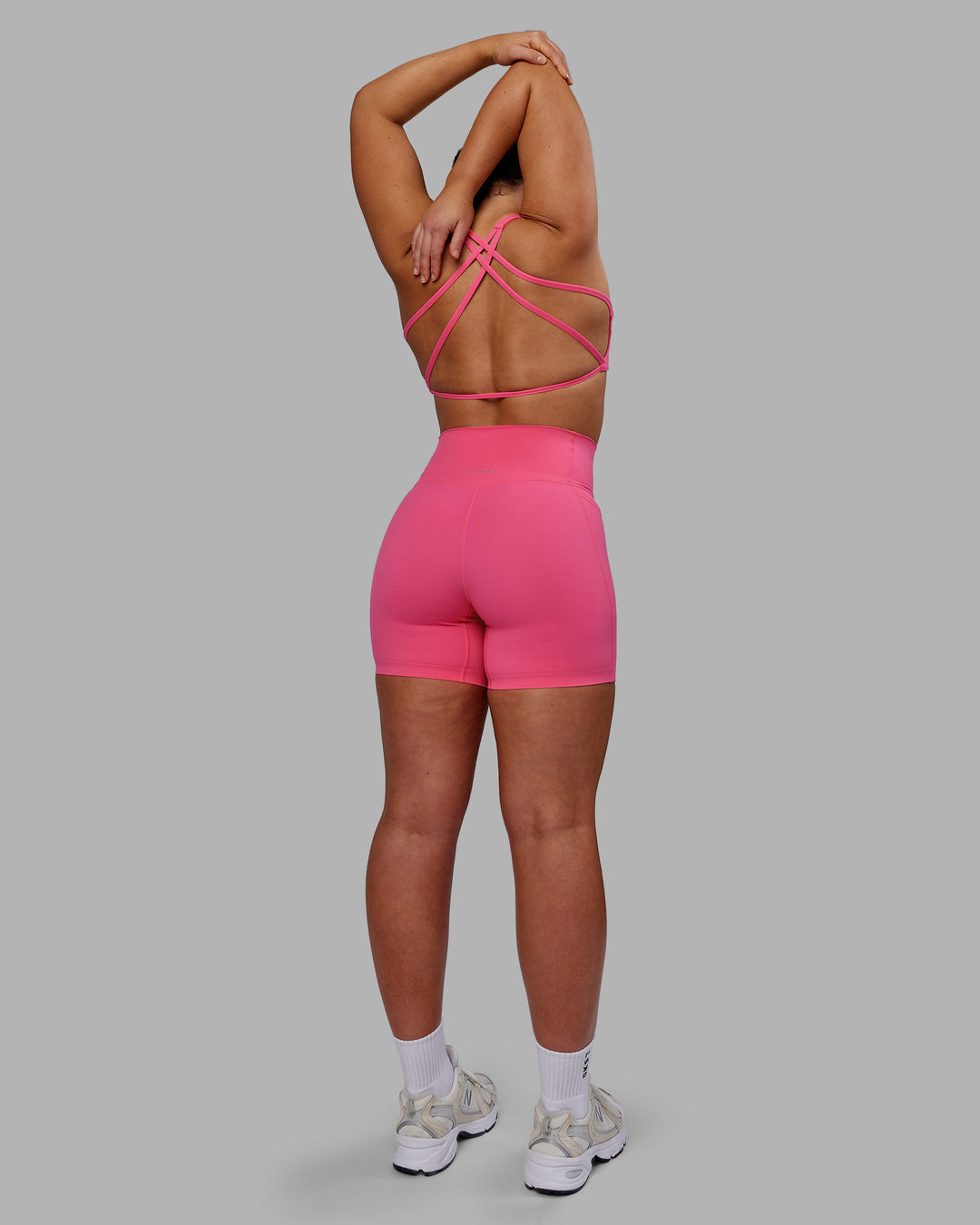 Woman wearing Aspire Sports Bra - Carmine Rose - view 6