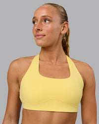 Woman wearing Aspire Sports Bra - Lemon | Thumbnail Index: 0