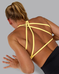 Woman wearing Aspire Sports Bra - Lemon | Thumbnail Index: 3