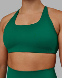 Woman wearing Aspire Sports Bra - Malachite | Thumbnail Index: 4