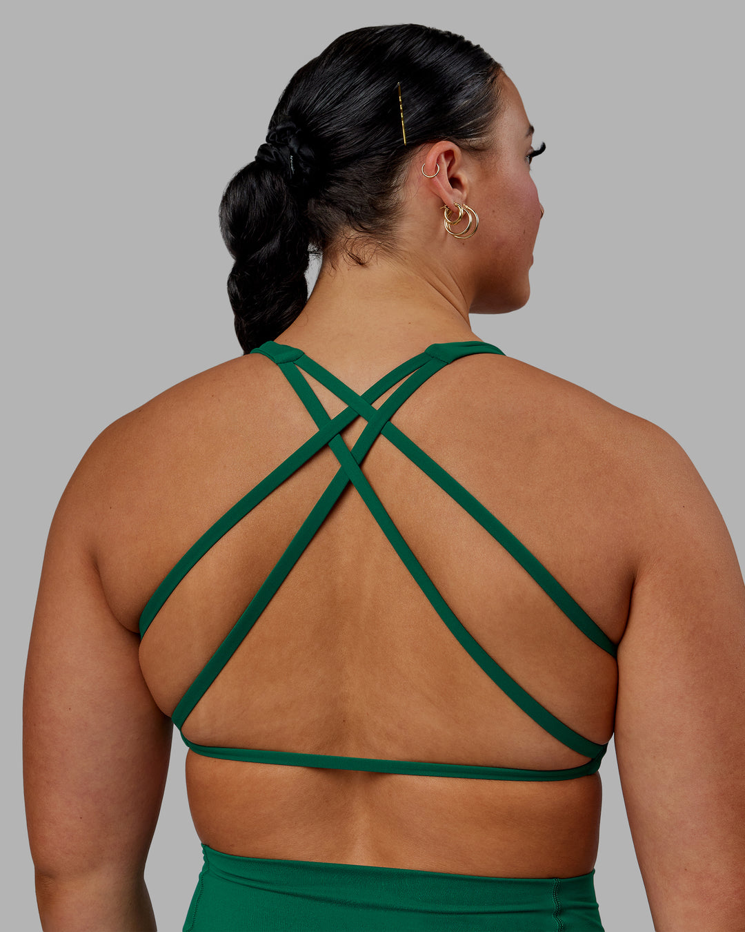 Woman wearing Aspire Sports Bra - Malachite - view 4