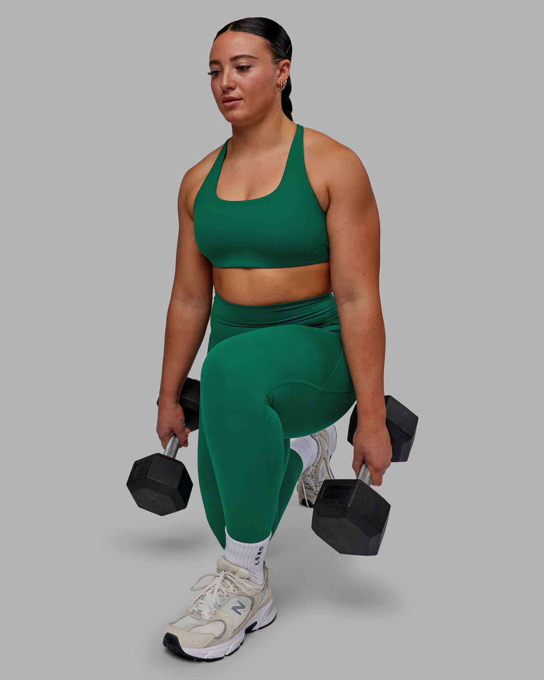 Woman wearing Aspire Sports Bra - Malachite - view 7