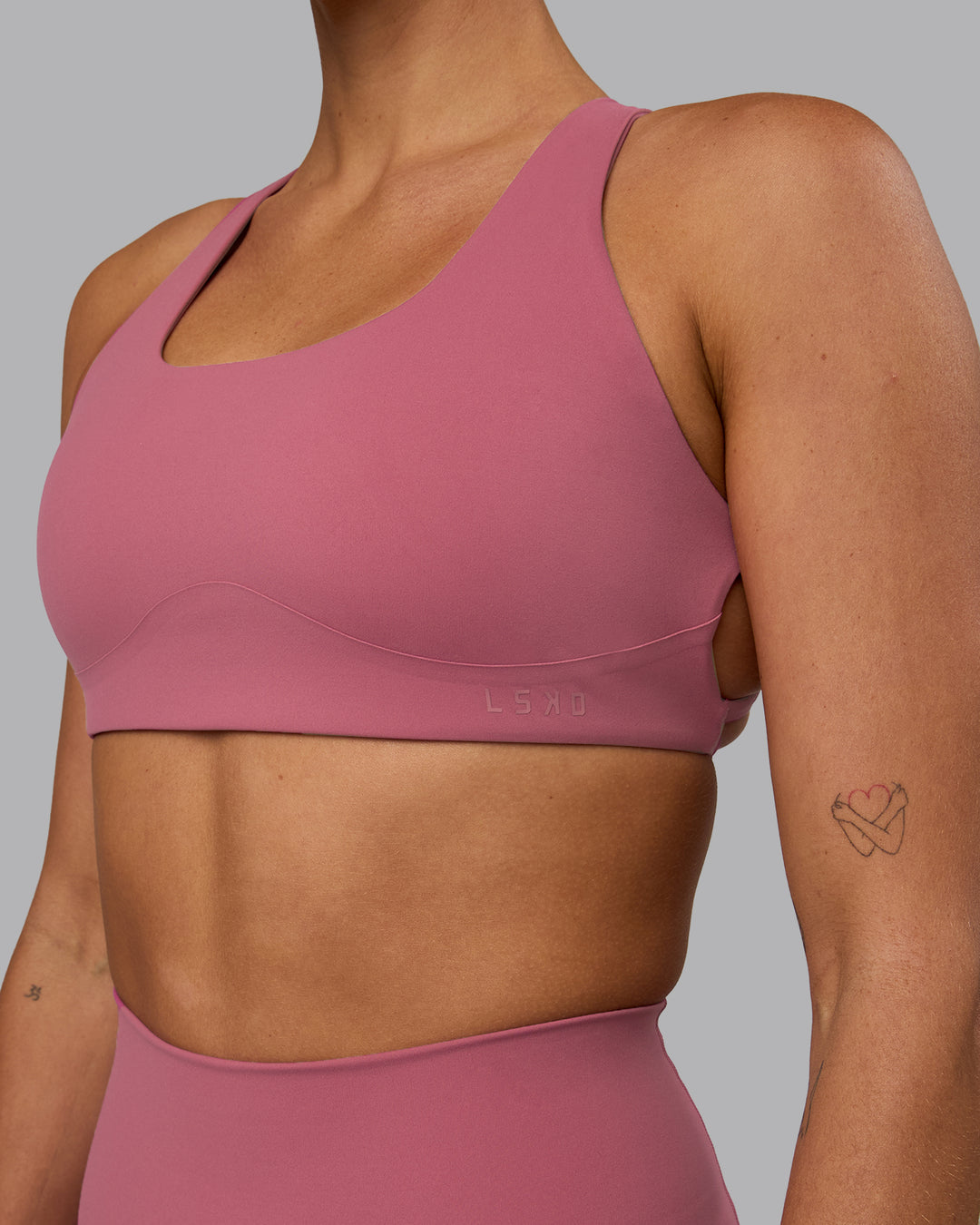 Woman wearing Aspire Sports Bra - Mauve Haze - view 8