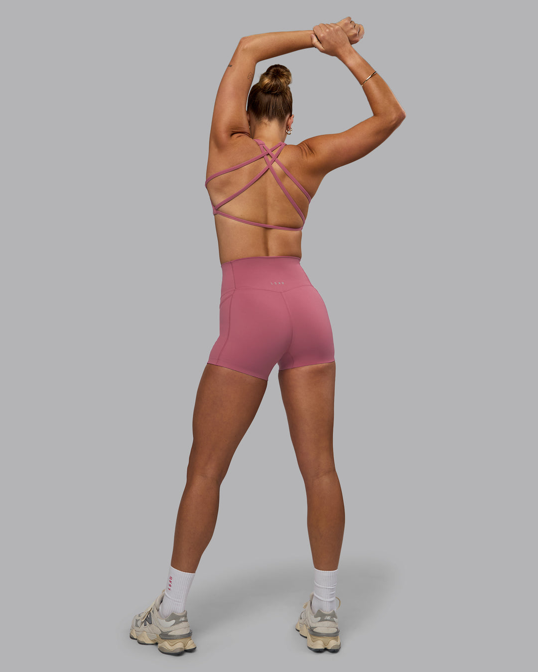 Woman wearing Aspire Sports Bra - Mauve Haze - view 6