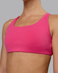 Woman wearing Aspire Sports Bra - Pink Flash | Thumbnail Index: 4