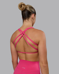 Woman wearing Aspire Sports Bra - Pink Flash | Thumbnail Index: 0