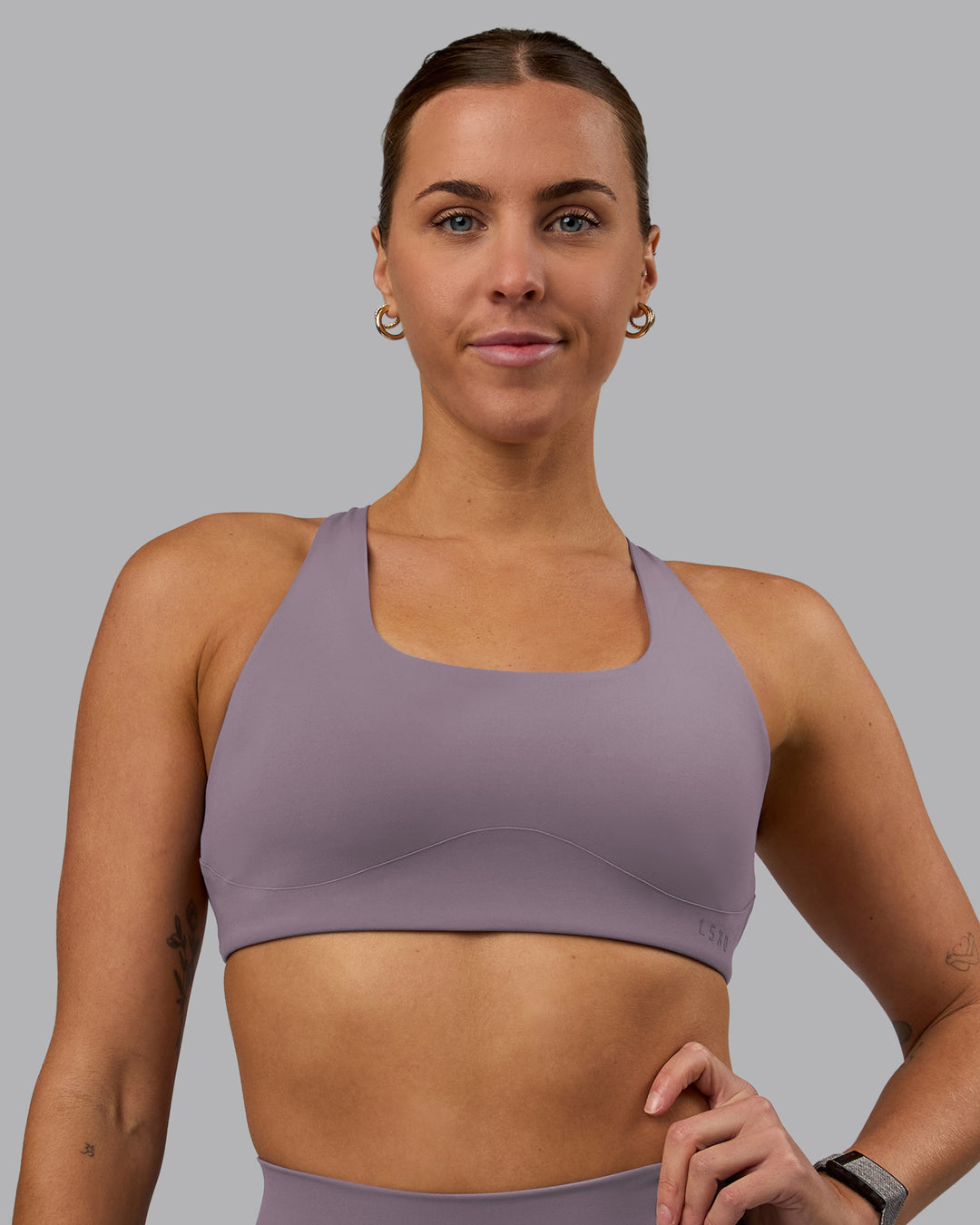 Woman wearing Aspire Sports Bra - Purple Sage - view 2