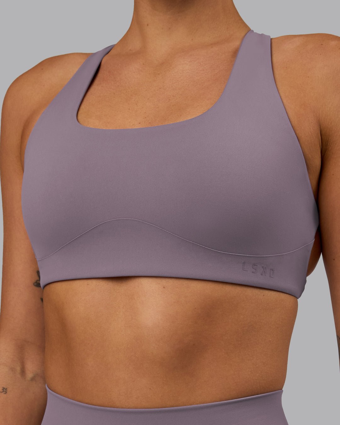 Woman wearing Aspire Sports Bra - Purple Sage - view 5