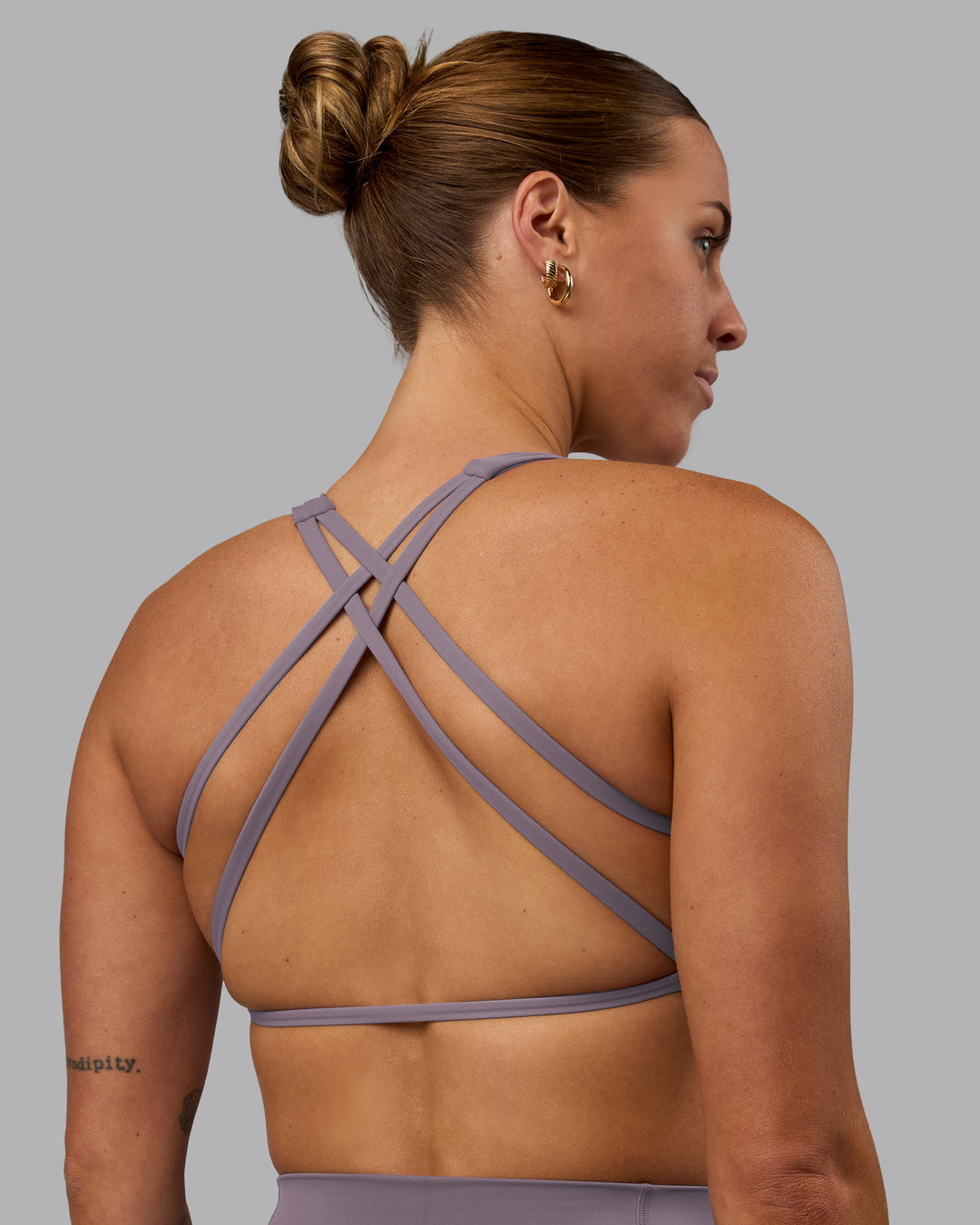 Woman wearing Aspire Sports Bra - Purple Sage - view 7