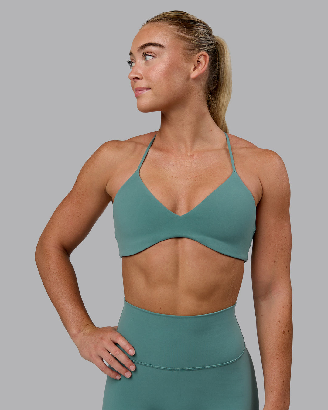 Woman wearing Aura Sports Bra - Sagebrush - view 1