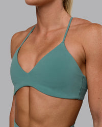 Woman wearing Aura Sports Bra - Sagebrush | Thumbnail Index: 3
