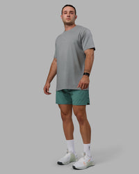 Man wearing Base FLXCotton Tee - Circular Grey | Thumbnail Index: 1
