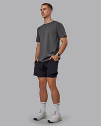 Man wearing Base FLXCotton Tee - Dark Storm | Thumbnail Index: 1