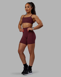 Woman wearing Bend Ultra High-Rise 6" Short - Dark Cherry | Thumbnail Index: 4