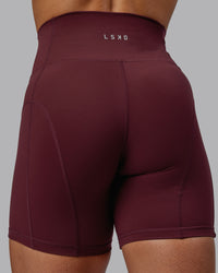 Woman wearing Bend Ultra High-Rise 6" Short - Dark Cherry | Thumbnail Index: 7