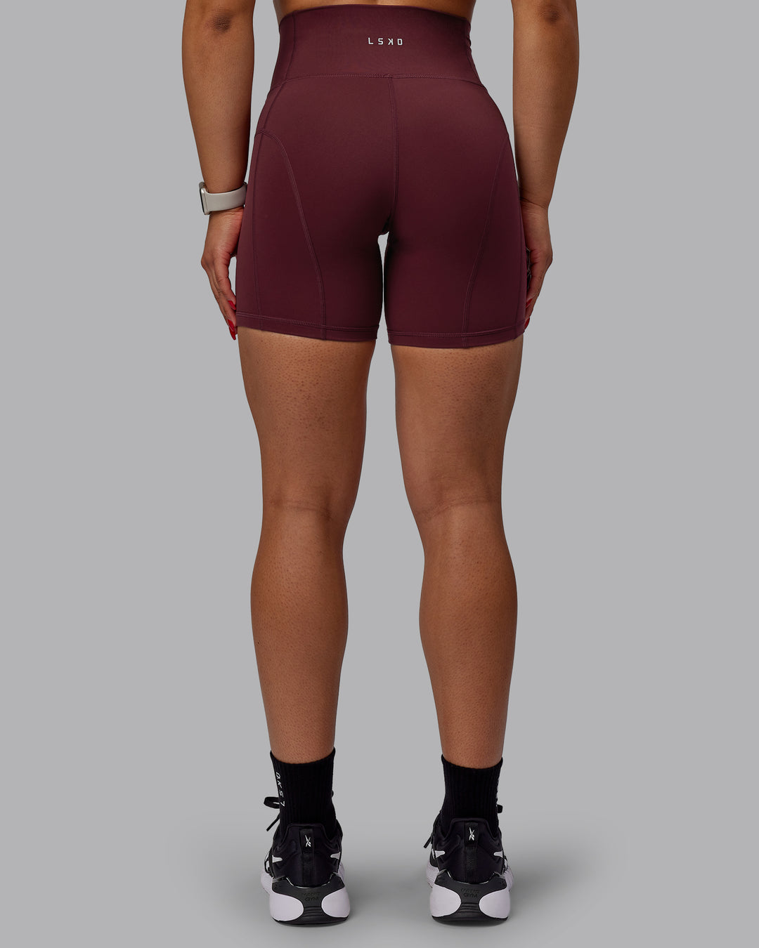 Woman wearing Bend Ultra High-Rise 6" Short - Dark Cherry - view 3