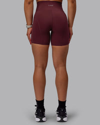 Woman wearing Bend Ultra High-Rise 6" Short - Dark Cherry | Thumbnail Index: 2