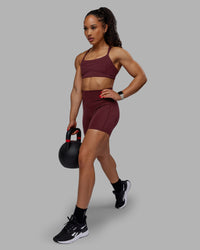Woman wearing Bend Ultra High-Rise 6" Short - Dark Cherry | Thumbnail Index: 1