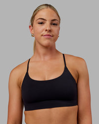 Woman wearing Bonded Sports Bra - Black | Thumbnail Index: 4