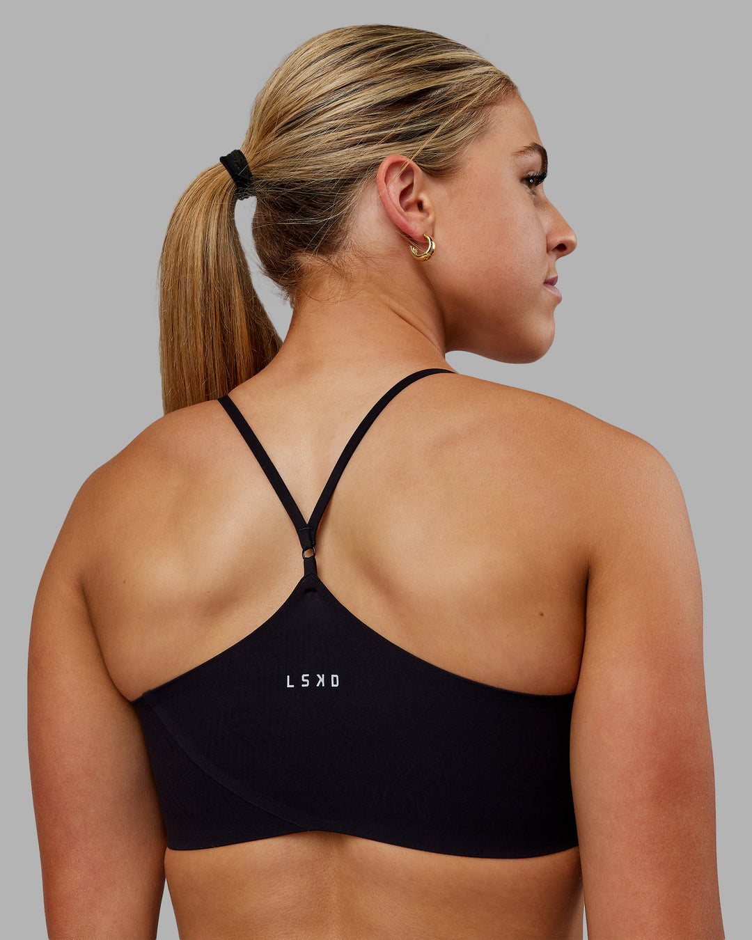 Woman wearing Bonded Sports Bra - Black - view 2
