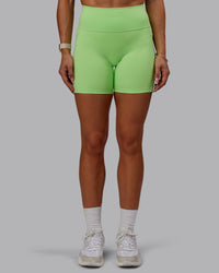 Woman wearing Bree Masters Fusion Ultra High-Rise 6" Short Pockets - Pastel Lime | Thumbnail Index: 6