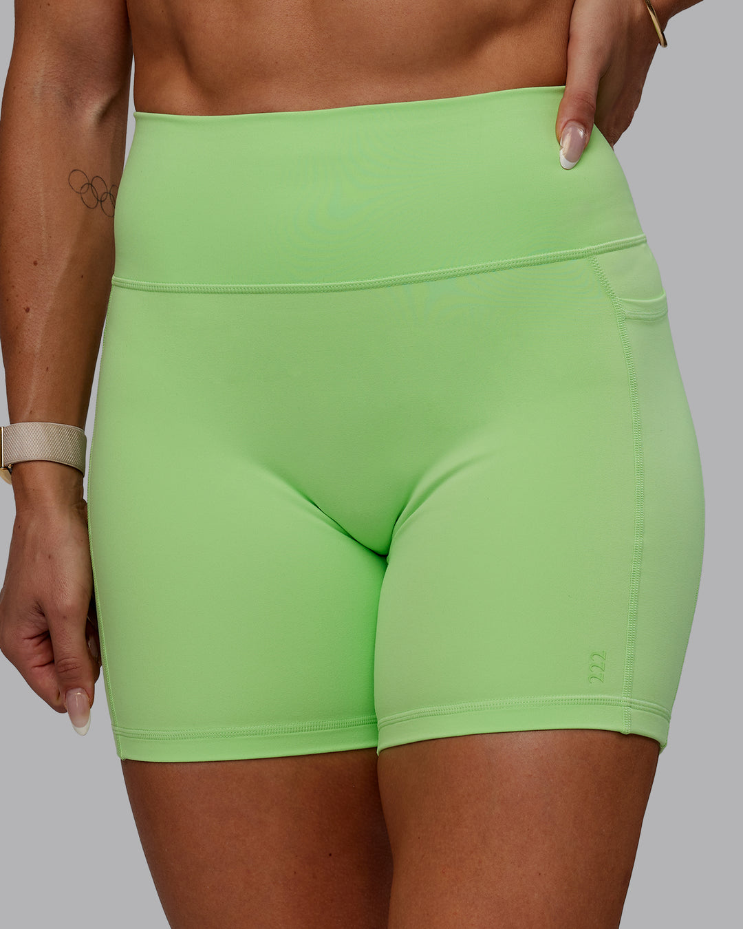 Woman wearing Bree Masters Fusion Ultra High-Rise 6" Short Pockets - Pastel Lime - view 5