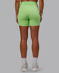 Woman wearing Bree Masters Fusion Ultra High-Rise 6" Short Pockets - Pastel Lime | Thumbnail Index: 3