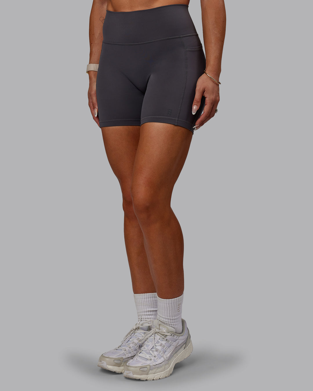 Woman wearing Bree Masters Fusion Ultra High-Rise 6" Short Pockets - Stormy - view 11