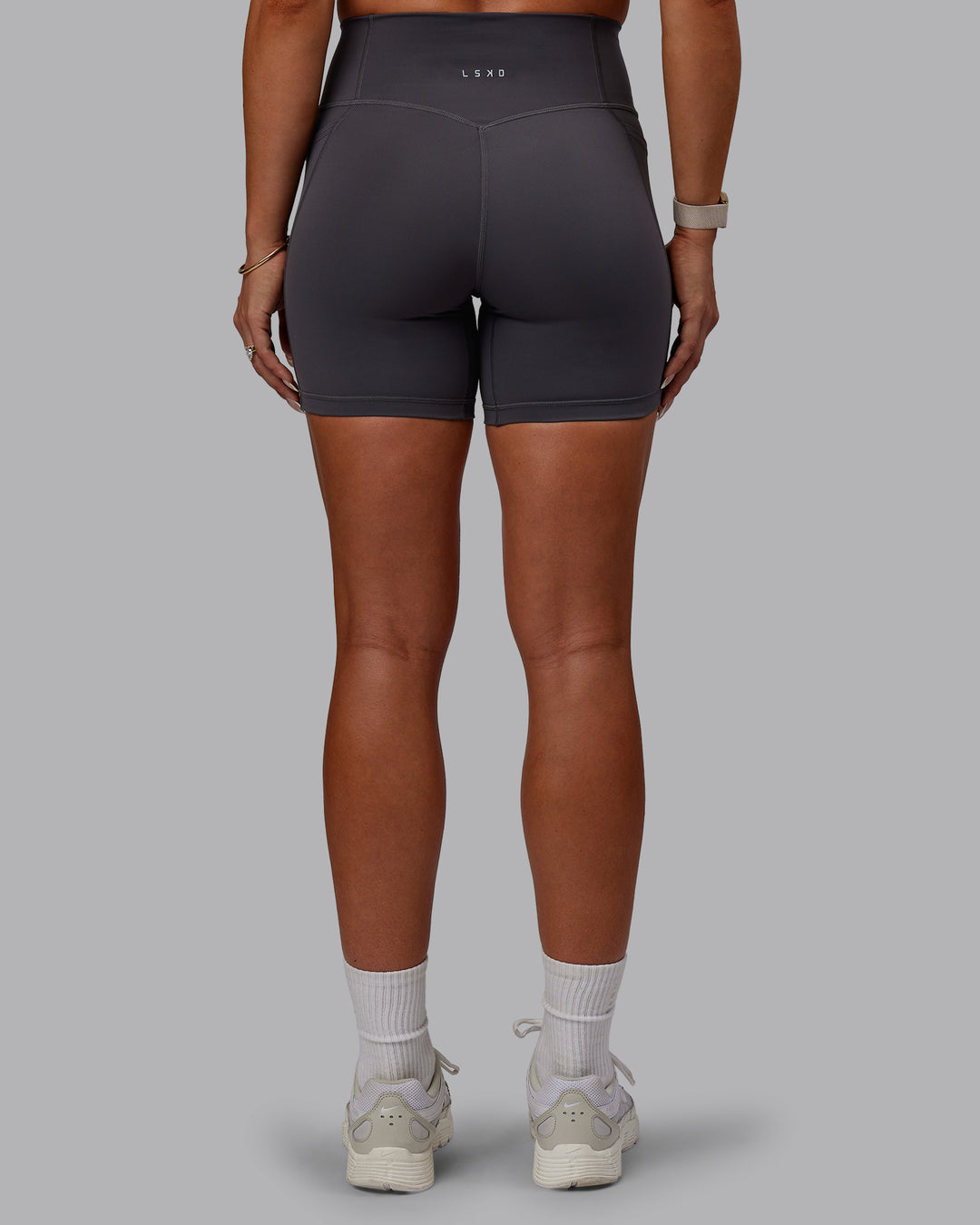 Woman wearing Bree Masters Fusion Ultra High-Rise 6" Short Pockets - Stormy - view 10