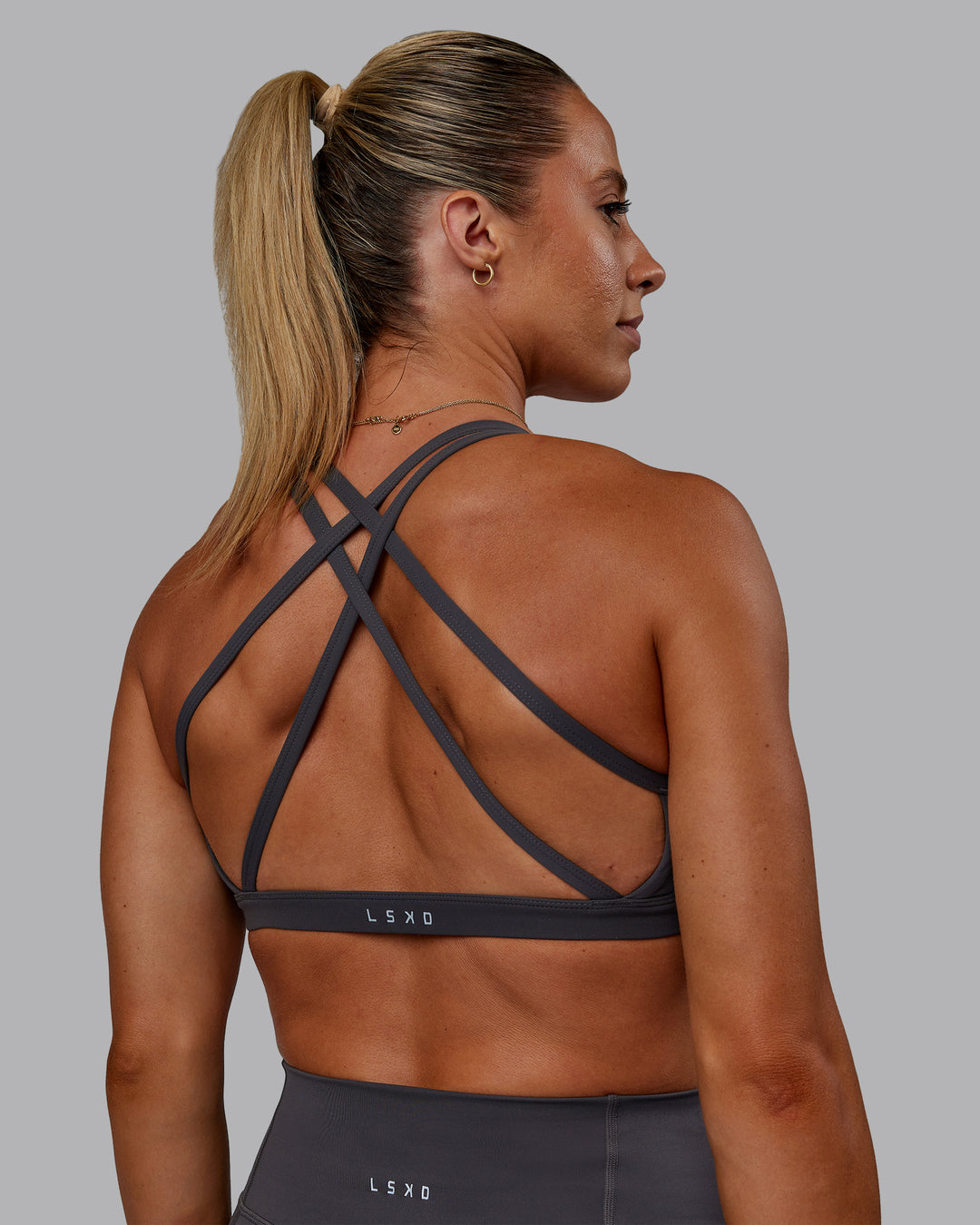 Woman wearing Bree Masters Velocity Sports Bra - Stormy - view 9