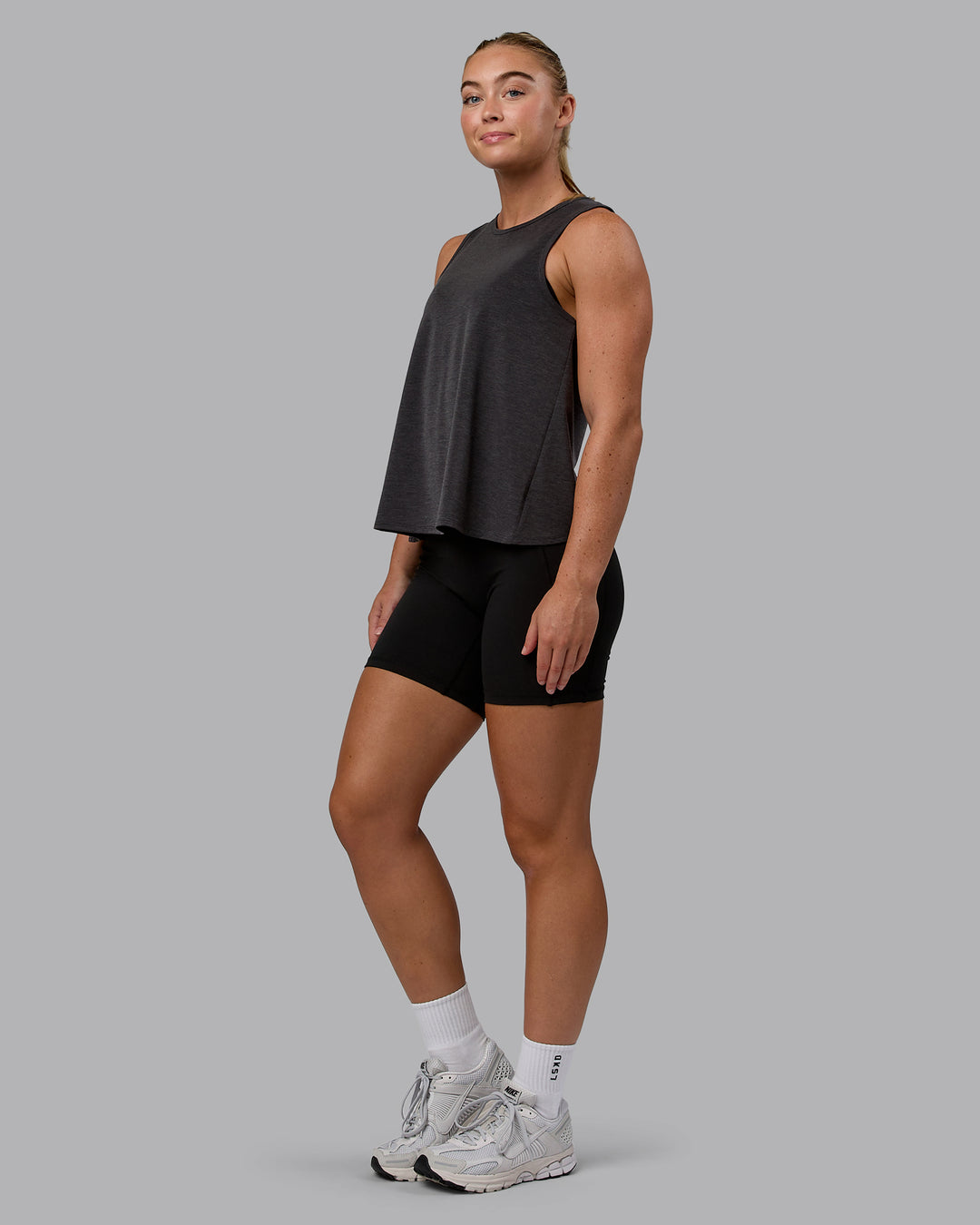 Woman wearing Breeze Training Tank - Black - view 4