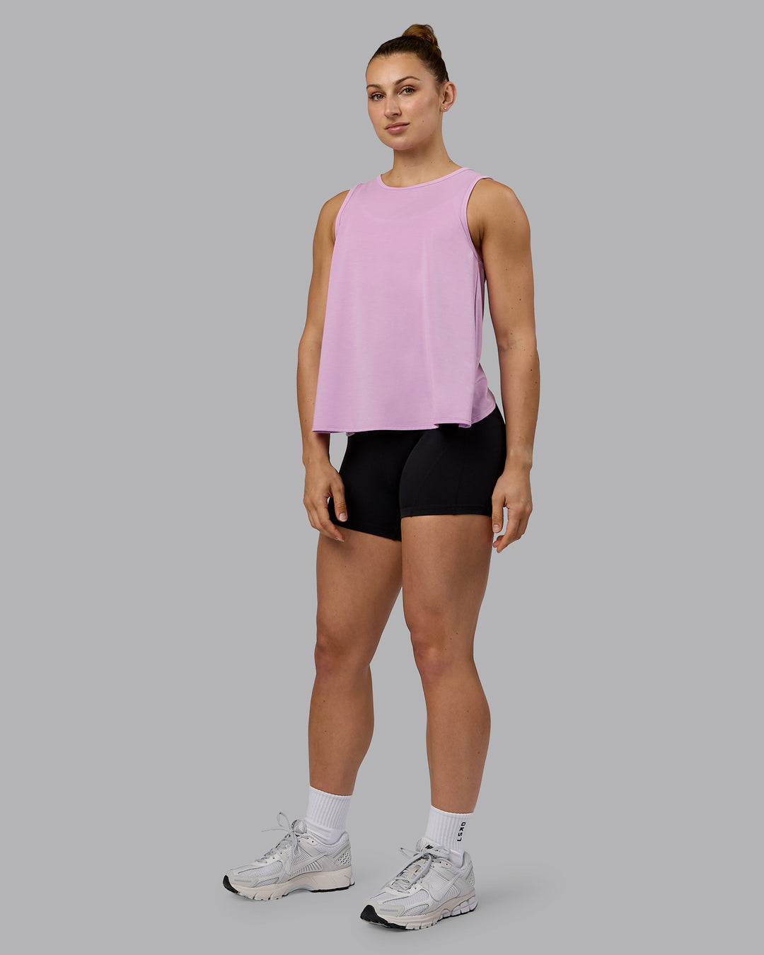 Woman wearing Breeze Training Tank - Pastel Orchid - view 4