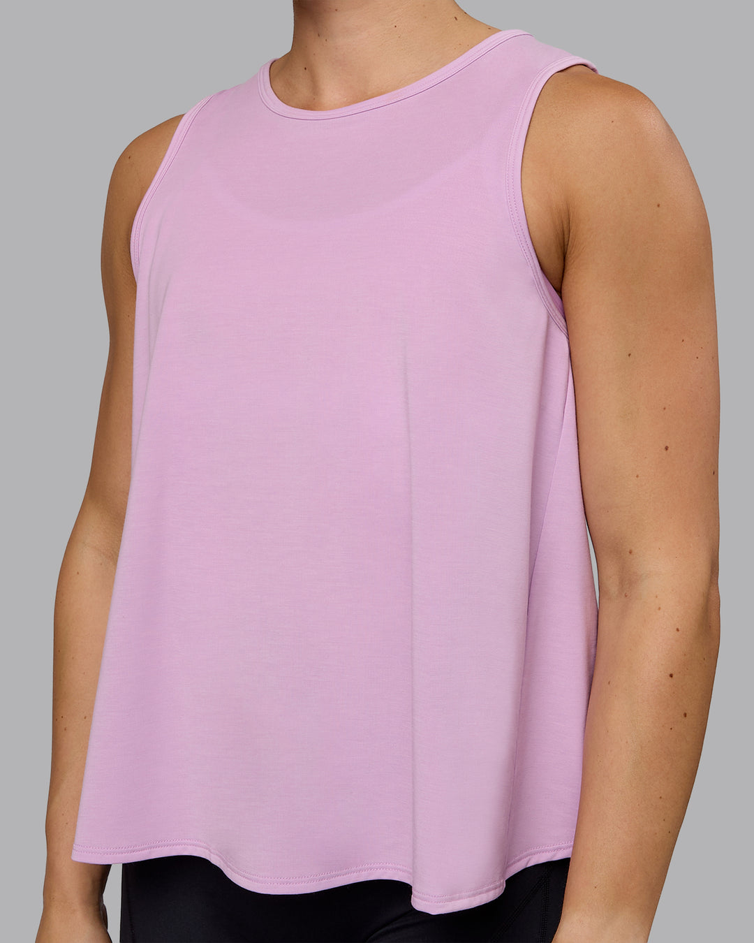 Woman wearing Breeze Training Tank - Pastel Orchid - view 6