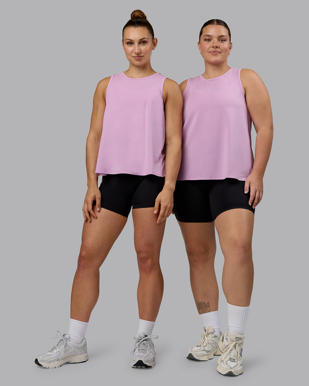 Woman wearing Breeze Training Tank - Pastel Orchid - view 5