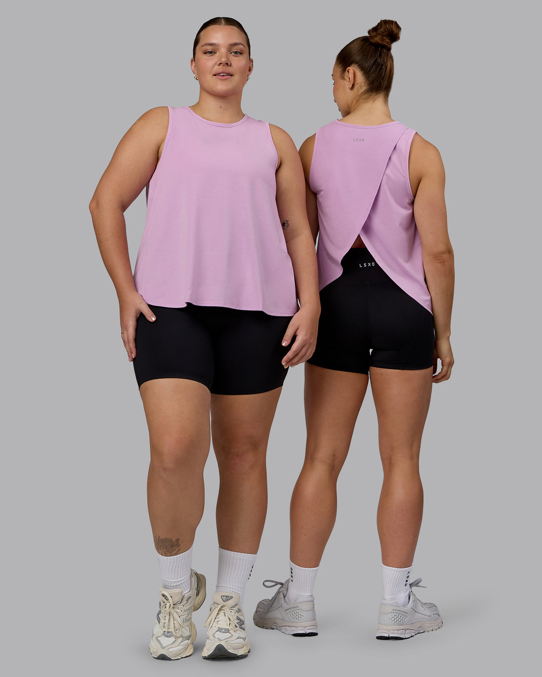 Woman wearing Breeze Training Tank - Pastel Orchid - view 1