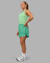 Woman wearing Challenger 5" Lined Performance Shorts - Mystic Green | Thumbnail Index: 7