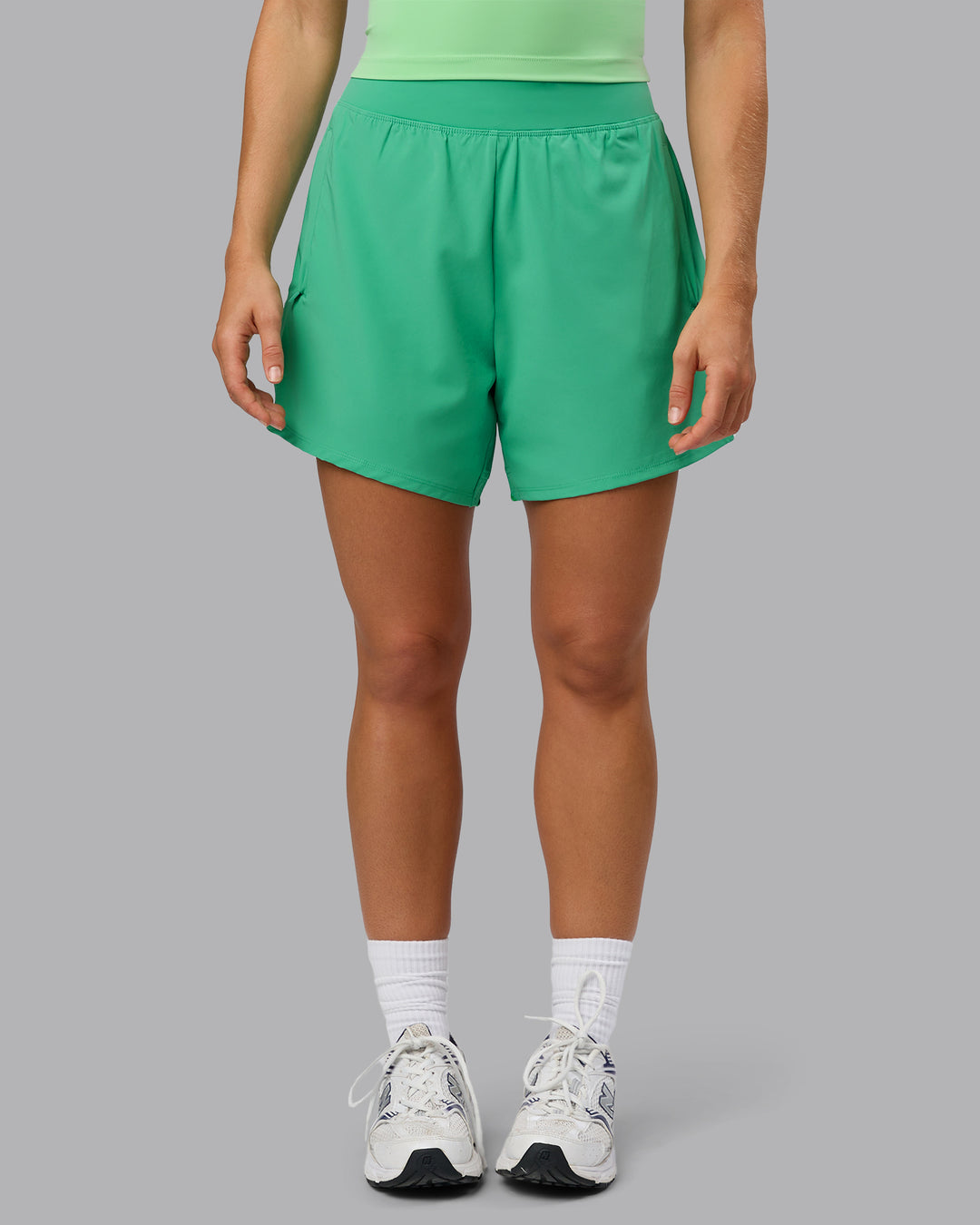 Woman wearing Challenger 5" Lined Performance Shorts - Mystic Green - view 7