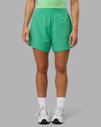 Woman wearing Challenger 5" Lined Performance Shorts - Mystic Green | Thumbnail Index: 6
