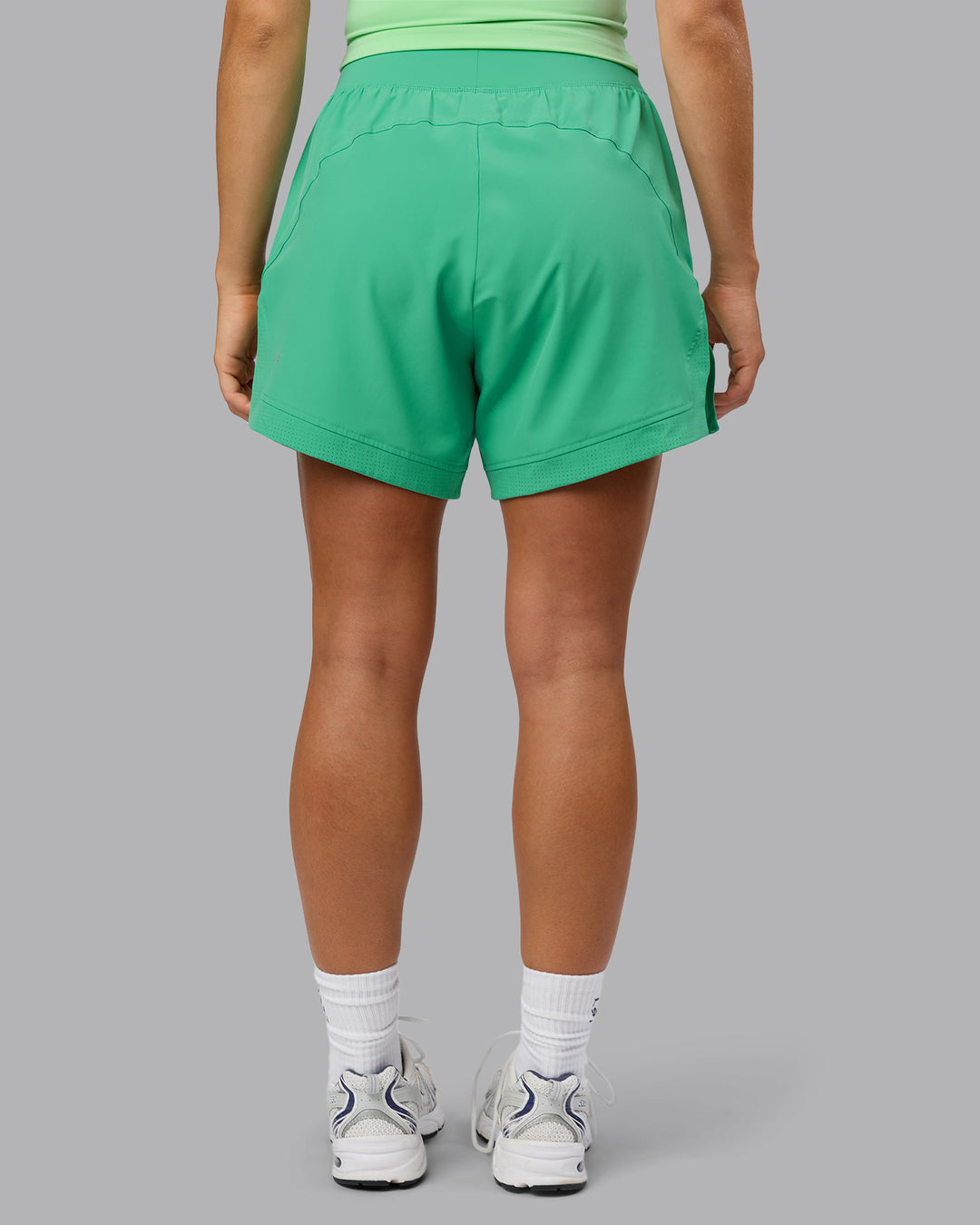 Woman wearing Challenger 5" Lined Performance Shorts - Mystic Green - view 5